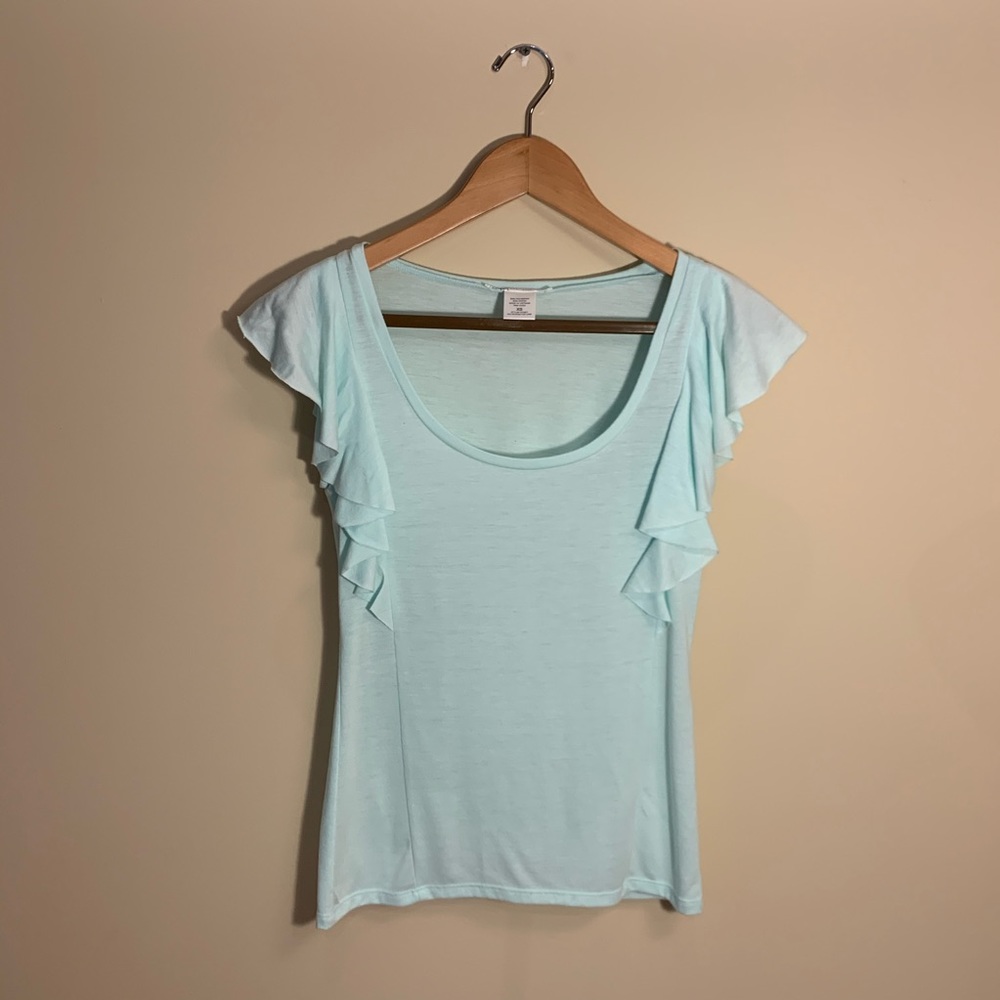 Light blue t shirt ruffled. XS